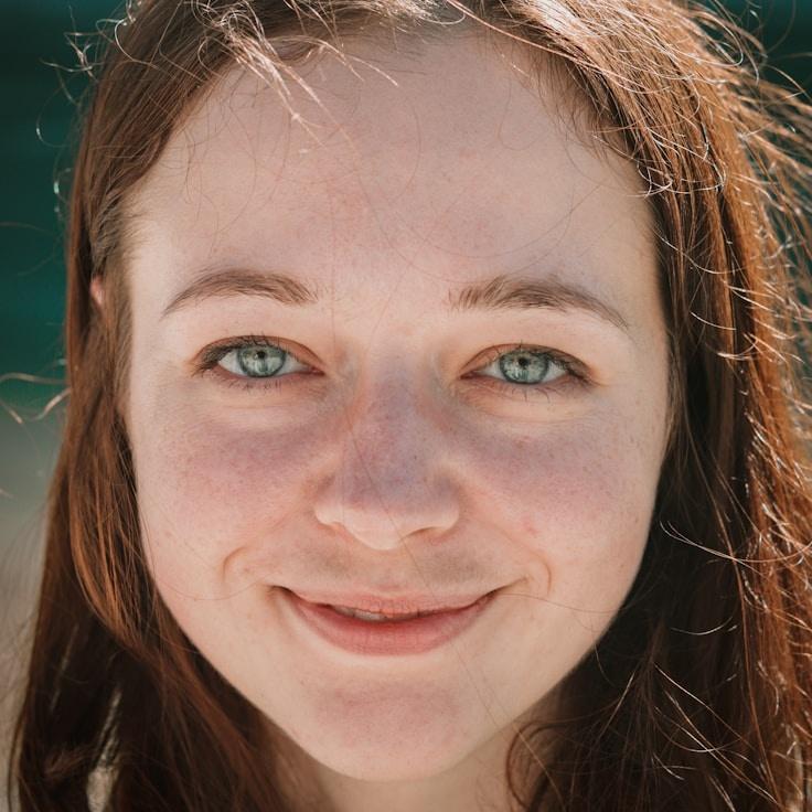 Anaya Verma, Lead Design Curator at RippleGroveFolio, reviewing corporate floral arrangements